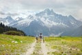 Father and two boys hike in mountain