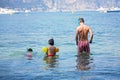 Father and two children, boys, preparing to go scuba diving Royalty Free Stock Photo