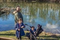 Father with two children is walking along the Aare river in springtime Royalty Free Stock Photo