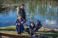 Father with two children is walking along the Aare river in springtime Royalty Free Stock Photo