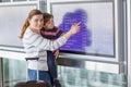 Father and two little sibling boys at the airport Royalty Free Stock Photo