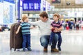 Father and two little sibling boys at the airport Royalty Free Stock Photo