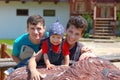 Father and two sons rest in a tourist complex in the mountains