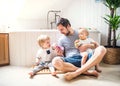 Father with two toddlers brushing teeth in the bathroom at home. Royalty Free Stock Photo