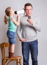 Father using smartphone ignoring his daughter Royalty Free Stock Photo