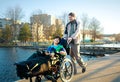 Father walking with disabled son in wheelchair at lake park Royalty Free Stock Photo