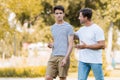 Father walking, gesturing and talking with