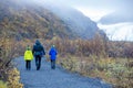 Father, walking with his children on a path towards Skaftafell Glacier national park on a gorgeous autumn day in Iceland Royalty Free Stock Photo