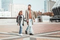 Father walking with his daughter after school