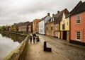 Family walk along the historic Quayside in the city of Norwich