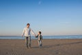 Father walks with his little son on a beach Royalty Free Stock Photo