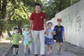 Father walks on the street with his childs on father`s day Royalty Free Stock Photo