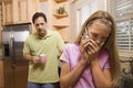 Father watching Daughter on phone Royalty Free Stock Photo