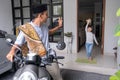 father waving goodbye to his daugther at front house before leaving to the mosque Royalty Free Stock Photo