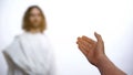 Father welcoming Jesus Christ to heaven, greeting son and giving helping hand Royalty Free Stock Photo