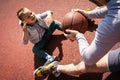 Father wit his son sitting on the basket ball court. Royalty Free Stock Photo