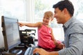 Father working in home office with daughter