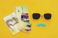 Father& x27;s day concept. Hipster yellow sunglasses and funny moustache next to photographs Royalty Free Stock Photo