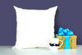 Father's Day or masculine birthday theme throw pillow styled with gifts.