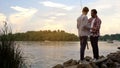 Father and 16 years old son preparing fishing rods, relaxing together near lake Royalty Free Stock Photo