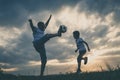 Father and young little boy playing in the field  with soccer ball Royalty Free Stock Photo