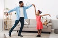 Fatherhood concept. Cute girl dancing with father Royalty Free Stock Photo