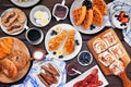 Fathers Day brunch table scene. Above view on a dark wood background.