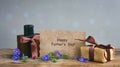 Fathers day card, gift box with brown ribbon, perfume bottle, pa