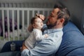 Fathers Day. Caucasian father talking to newborn baby girl. Parent holding rocking child daughter in hands. Authentic lifestyle Royalty Free Stock Photo