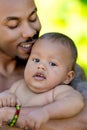 Fathers day. Close up portrait of african american father kissing multiracial baby. Father kiss Biracial child. Closeup Royalty Free Stock Photo