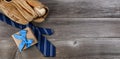 Fathers day concept with blue dress tie, baseball items and a giftbox on rustic wooden background Royalty Free Stock Photo