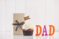 Fathers day concept. Delicious creative cupcake and gift box on