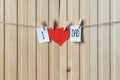 Fathers day concept. Message with paper heart hanging with pins over light wooden board. Happy Birthday Royalty Free Stock Photo