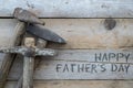 Fathers day concept, Wooden background with a hammer