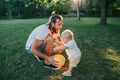 Fathers Day. Father playing ball with toddler baby boy outdoor. Parent spending time together with child son in a park. Authentic Royalty Free Stock Photo