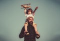 Fathers day. Father and son. Father giving son ride on back. Portrait of happy father giving son piggyback ride on his Royalty Free Stock Photo