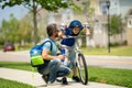 Fathers day. Father teaching son ride a bicycle. Father and son cycling on bike on summer day. Father support child Royalty Free Stock Photo