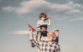 Fathers day - grandfather, father and son are hugging and having fun together. Airplane ready to fly. Portrait of happy Royalty Free Stock Photo