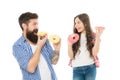 Fathers day present. Perfect for dads with sweet tooth. Girl child and dad hold colorful glazed donuts. Sweets and Royalty Free Stock Photo