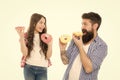 Fathers day present. Perfect for dads with sweet tooth. Girl child and dad hold colorful glazed donuts. Sweets and Royalty Free Stock Photo