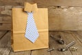 Fathers Day shirt and tie gift bag on wood Royalty Free Stock Photo