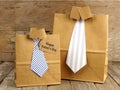 Fathers Day shirt and tie gift bags on a wood Royalty Free Stock Photo