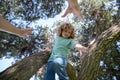 Fathers hand. Father parent boy climb branches of tree.