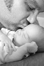 Fathers kissing newborn daughter Royalty Free Stock Photo