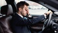Stressed businessman driving alone in his new car Royalty Free Stock Photo