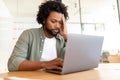 Fatigued businessman using laptop for working, the guy tired and burnout Royalty Free Stock Photo