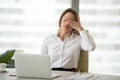 Fatigued tired businesswoman feeling exhausted of overwork in of