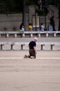 Faithful advancing on their knees in the square of the Sanctuary of Fatima, Portugal