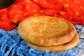 Fatir, uzbek flatbread on blue arab scarf and red cloth