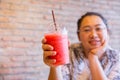 Fatty women tubby drinking fruit smoothie fruit healthy drink good for diet and cool ice Royalty Free Stock Photo